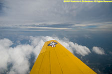 left wing and clouds