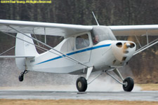 wheel landing on pavement, in a puddle